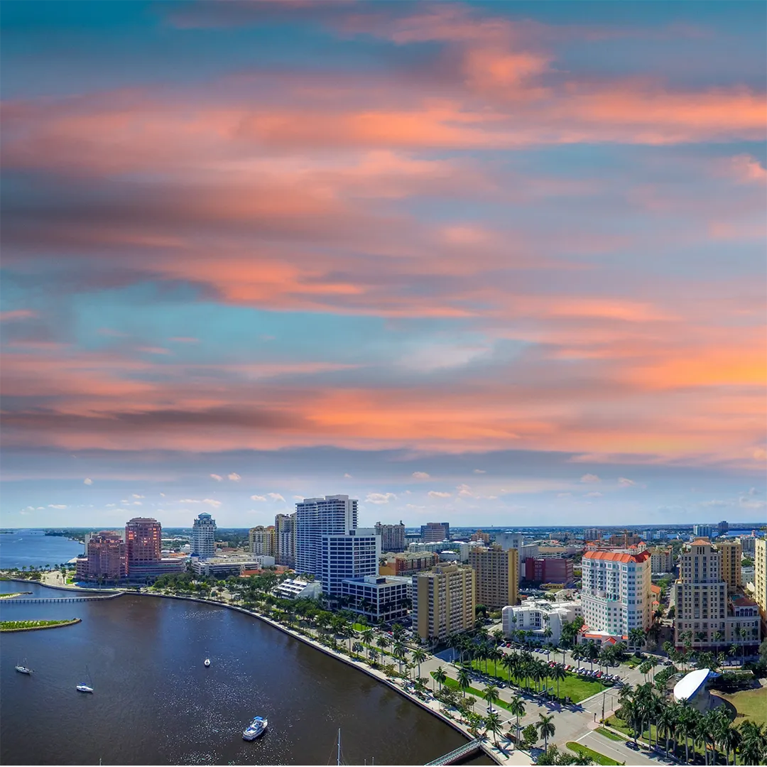 West Palm Beach skyline featuring modern skyscrapers against a clear blue sky.